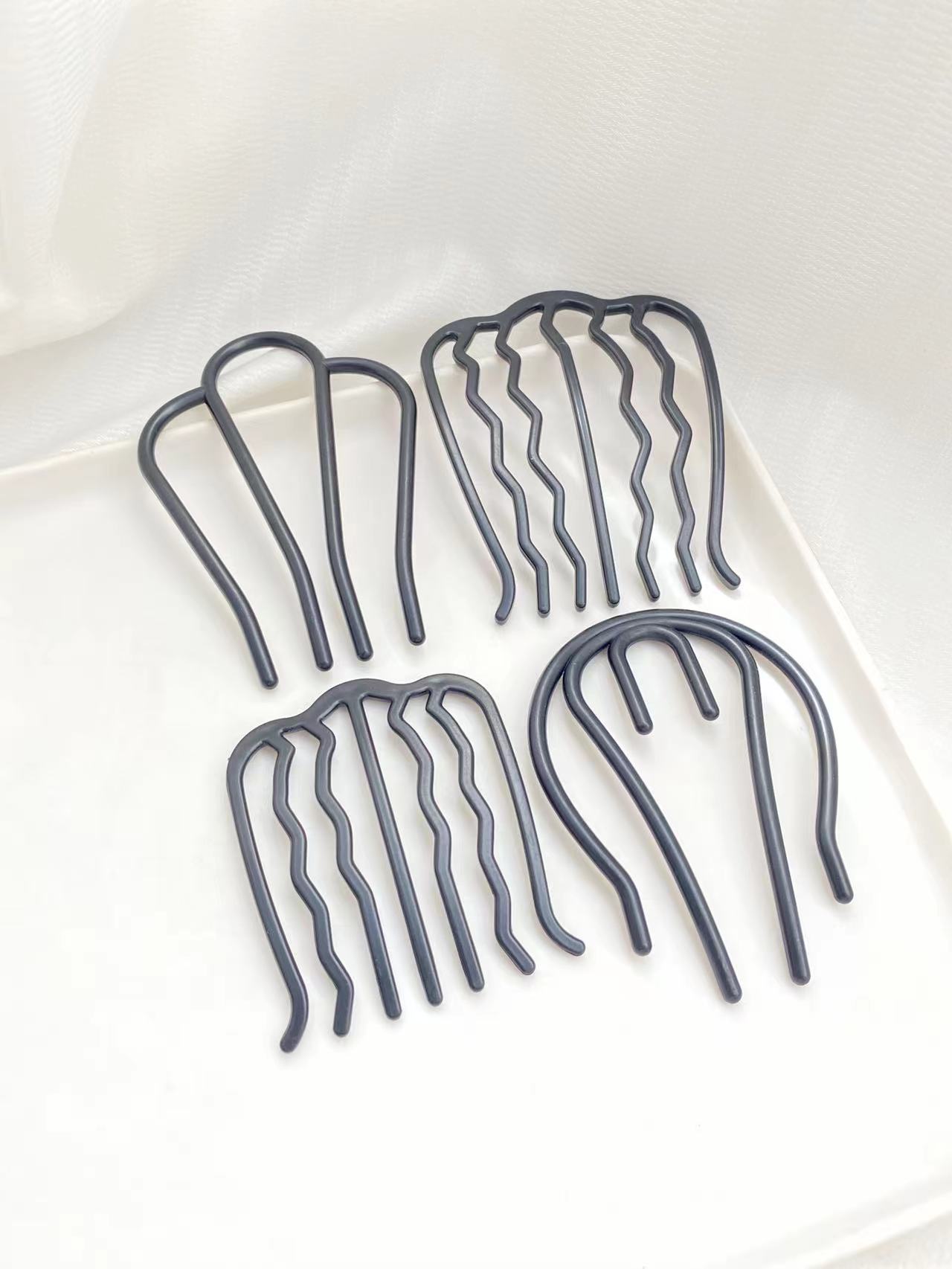 Women Accessories Shop Design - 4 stuks zwarte haarkammen met verschillende
